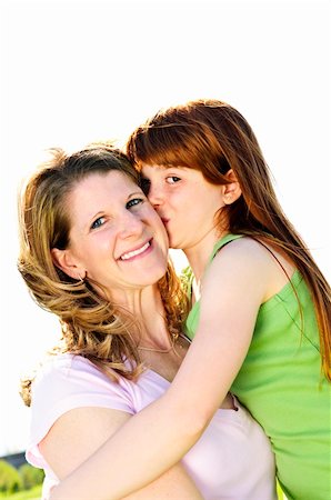 simsearch:400-04612785,k - Portrait of happy child hugging and kissing her mother Stock Photo - Budget Royalty-Free & Subscription, Code: 400-04613238