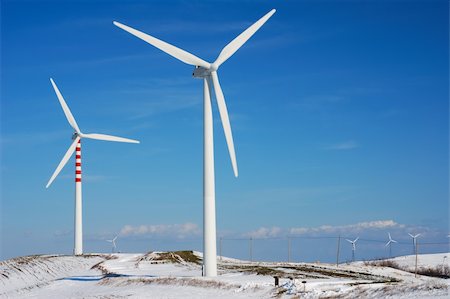 rotor - Modern and ecologic wind turbines with blue sky and snowy hill Stock Photo - Budget Royalty-Free & Subscription, Code: 400-04613613