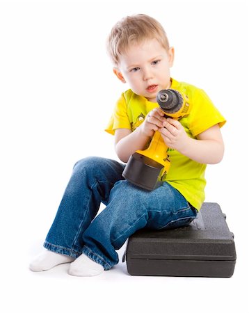 simsearch:640-02950998,k - Astonished little boy with electric screwdriver Stock Photo - Budget Royalty-Free & Subscription, Code: 400-04613759