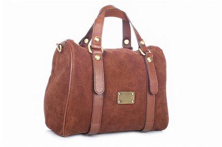 A brown handbag with soft shadow on white background Foto de stock - Super Valor sin royalties y Suscripción, Código: 400-04613857