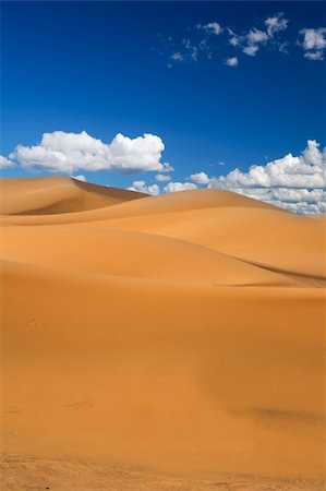 sahara desert terrain - sand dunes and cumulus clouds over them, Erg Chebbi, Morocco Stock Photo - Budget Royalty-Free & Subscription, Code: 400-04613915