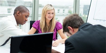 simsearch:400-04106006,k - Multi-ethnic business team working together in an office Stock Photo - Budget Royalty-Free & Subscription, Code: 400-04624315