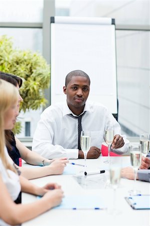 simsearch:400-05155599,k - Afro-American businessman drinking champagne in office with his team Stock Photo - Budget Royalty-Free & Subscription, Code: 400-04624323