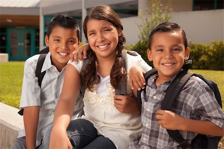 Cute Brothers and Sister Wearing Backpacks Ready for School. Foto de stock - Super Valor sin royalties y Suscripción, Código: 400-04624595