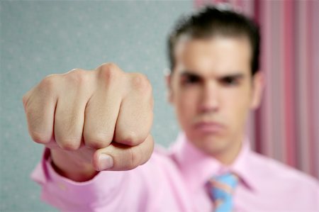 simsearch:400-04333650,k - angry aggresive businessman with fist closeup to camera Stock Photo - Budget Royalty-Free & Subscription, Code: 400-04624633