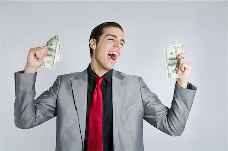 Businessman young with dollar notes suit and tie on gray background Stock Photo - Budget Royalty-Free & Subscription, Code: 400-04624768