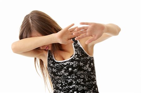 people running away scared - Teen girl frighten, covering her face - abuse crime concept Photographie de stock - Aubaine LD & Abonnement, Code: 400-04624849