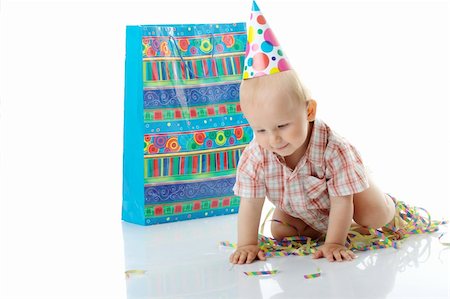 simsearch:400-06063102,k - Child boy in birthday hat over white Fotografie stock - Microstock e Abbonamento, Codice: 400-04624894