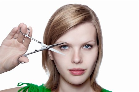 simsearch:400-04556226,k - beautiful blonde girl is looking through scissors, isolated on white Stock Photo - Budget Royalty-Free & Subscription, Code: 400-04624962