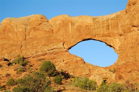 Sunrise at North Window Arch in Arches National Park near Moab, Utah, Stockbilder - Microstock & Abonnement, Bildnummer: 400-04625084