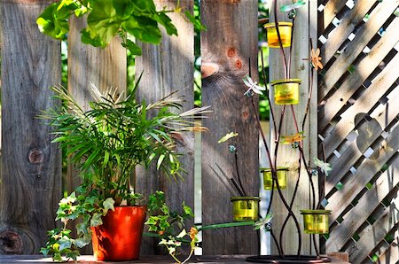 pot holder - Wooden house deck decorated with flower pots and candle holder Stock Photo - Budget Royalty-Free & Subscription, Code: 400-04625093