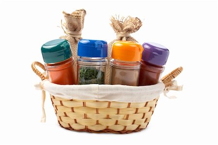 simsearch:400-06919406,k - Assortment of spices jars for prepare tasty food in a basket over a white background Foto de stock - Royalty-Free Super Valor e Assinatura, Número: 400-04625666