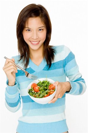 A pretty young asian woman with a small bowl of salad Stock Photo - Budget Royalty-Free & Subscription, Code: 400-04625797