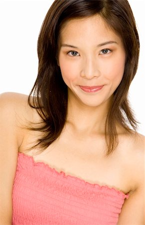 A cute young teenage asian woman in pink top Stock Photo - Budget Royalty-Free & Subscription, Code: 400-04625802