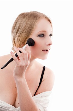 Young woman applies makeup with a soft brush beautiful skin Stock Photo - Budget Royalty-Free & Subscription, Code: 400-04625965