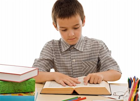 simsearch:400-05078169,k - Schoolboy reading an old book - isolated Fotografie stock - Microstock e Abbonamento, Codice: 400-04626362