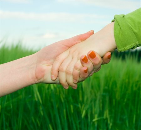 shaking hands kids - two hands Stock Photo - Budget Royalty-Free & Subscription, Code: 400-04626451