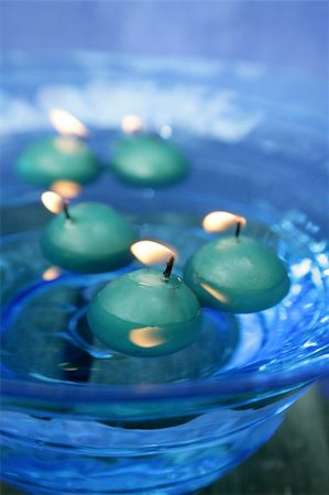 green candles over blue glass bowl of water Stock Photo - Budget Royalty-Free & Subscription, Code: 400-04626492
