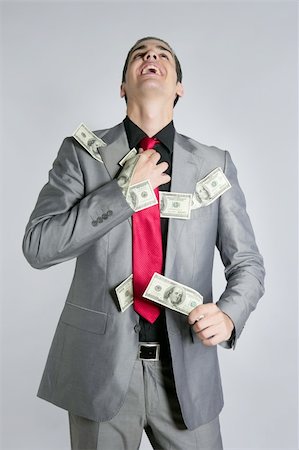 Businessman young with dollar notes suit and tie on gray background Stock Photo - Budget Royalty-Free & Subscription, Code: 400-04627018
