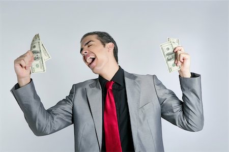Businessman young with dollar notes suit and tie on gray background Stock Photo - Budget Royalty-Free & Subscription, Code: 400-04627019
