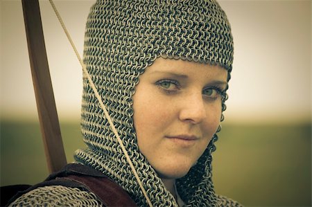 bows woman / medieval armor / historical story  / retro split toned Stock Photo - Budget Royalty-Free & Subscription, Code: 400-04627193