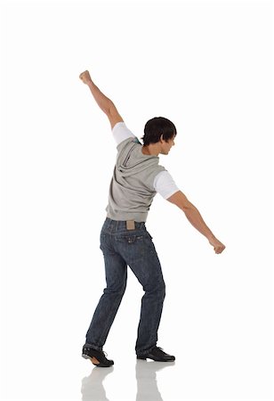 Single Caucasian male tap dancer wearing jeans showing various steps in studio with white background and reflective floor. Not isolated Stock Photo - Budget Royalty-Free & Subscription, Code: 400-04627349