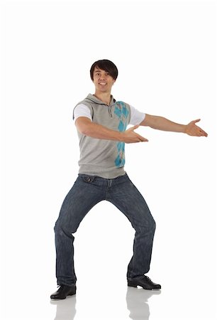 Single Caucasian male tap dancer wearing jeans showing various steps in studio with white background and reflective floor. Not isolated Stock Photo - Budget Royalty-Free & Subscription, Code: 400-04627351