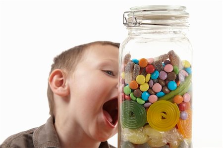 spoiled for choice - young boy showing expression of excitement at a candy jar Stock Photo - Budget Royalty-Free & Subscription, Code: 400-04628069