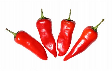 person with hot pepper - Four red hot chili peppers on white background Stock Photo - Budget Royalty-Free & Subscription, Code: 400-04629015