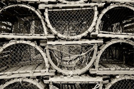 An image of old lobster traps resting by the sea. Foto de stock - Royalty-Free Super Valor e Assinatura, Número: 400-04629114