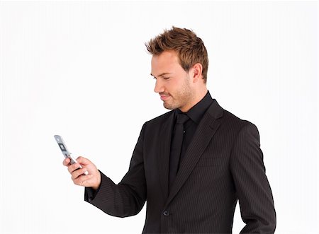 simsearch:400-05718346,k - Attractive businessman sending a text with a mobile phone Foto de stock - Super Valor sin royalties y Suscripción, Código: 400-04629320