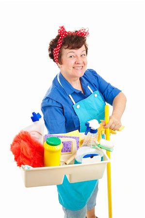 Cheerful cleaning lady holding her tray of cleaning tools and products.  Isolated on white. Foto de stock - Super Valor sin royalties y Suscripción, Código: 400-04629461