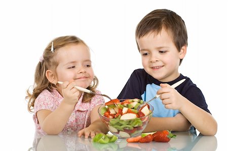 simsearch:400-04979626,k - Happy smiling kids eating fruit salad - isolated Foto de stock - Super Valor sin royalties y Suscripción, Código: 400-04629658