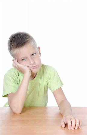 simsearch:400-04057188,k - Kid with a thinking expression at the table Stock Photo - Budget Royalty-Free & Subscription, Code: 400-04629661