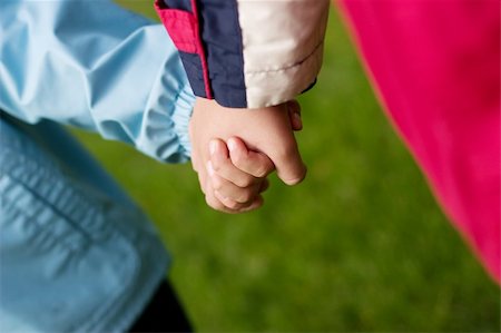 shaking hands kids - Two hands of baby on walk Stock Photo - Budget Royalty-Free & Subscription, Code: 400-04629838