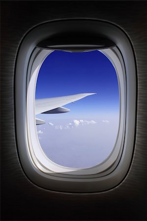 aeroplane window with blue skies Stock Photo - Budget Royalty-Free & Subscription, Code: 400-04629915