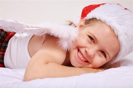 Lovely little girl with angel wings and Santa hat Stock Photo - Budget Royalty-Free & Subscription, Code: 400-04629949