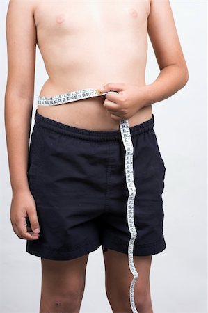 close up of  boy measuring waist Stock Photo - Budget Royalty-Free & Subscription, Code: 400-04620083