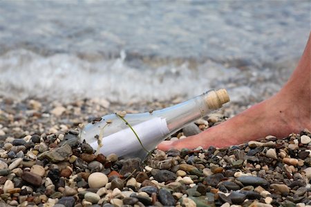 Transparent glass bottle with a note on seacoast Stock Photo - Budget Royalty-Free & Subscription, Code: 400-04620216