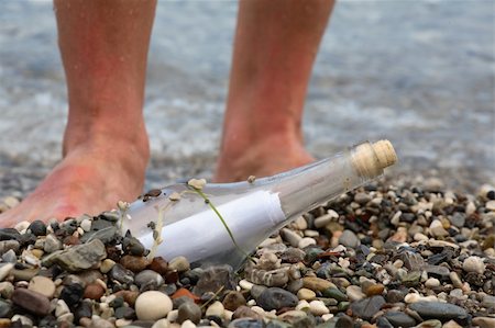 Transparent glass bottle with a note on seacoast Stock Photo - Budget Royalty-Free & Subscription, Code: 400-04620217