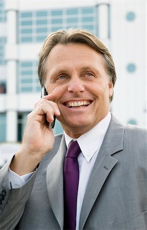 simsearch:400-08159452,k - a handsome forties businessman enjoys a friendly chat on his cellphone. Stock Photo - Budget Royalty-Free & Subscription, Code: 400-04620527