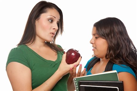face pack - Hispanic Mother and Daughter with Books and Apple Ready for School Isolated on a White Background. Stock Photo - Budget Royalty-Free & Subscription, Code: 400-04620896