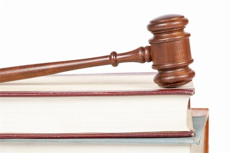 Wooden gavel from the court and law books isolated on white background. Shallow depth of field Foto de stock - Super Valor sin royalties y Suscripción, Código: 400-04621322