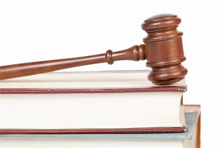 Wooden gavel from the court and law books isolated on white background. Shallow depth of field Stock Photo - Budget Royalty-Free & Subscription, Code: 400-04621322