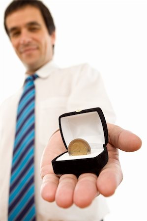 Businessman offering one euro coin in a jewel gift box - isolated success concept Photographie de stock - Aubaine LD & Abonnement, Code: 400-04621573
