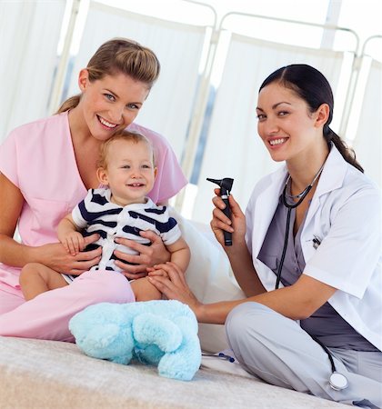 stethoscope girl and boy - Baby with pediatrician and nurse in hospital smiling at the camera Stock Photo - Budget Royalty-Free & Subscription, Code: 400-04621604