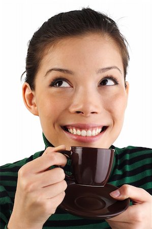 Beautiful young mixed asian / caucasian woman drinking espresso coffee while Looking to the upper corner. Isolated on white background. Stock Photo - Budget Royalty-Free & Subscription, Code: 400-04621742