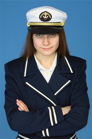 sailor captains uniform - Portrait of the beautiful captain on a blue background Stock Photo - Budget Royalty-Free & Subscription, Code: 400-04622056