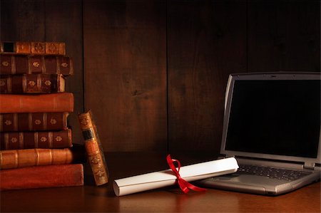 Antique books, diploma with laptop on school desk Stock Photo - Budget Royalty-Free & Subscription, Code: 400-04622200