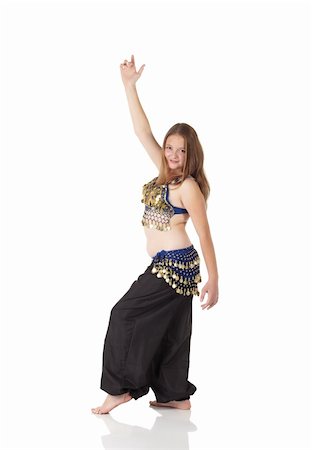 simsearch:400-04627234,k - Young Caucasian belly dancing girl in beautiful decorated clothes on white background and reflective floor. Not isolated Foto de stock - Super Valor sin royalties y Suscripción, Código: 400-04623143